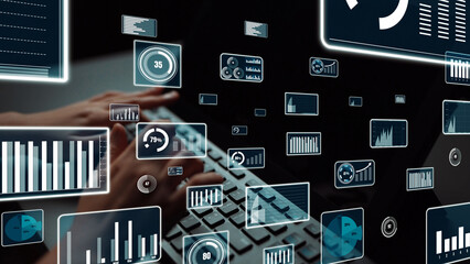 A close-up view of hands typing on a keyboard with multiple digital analytics screens displaying various graphs and data visualizations, emphasizing modern technology and business insights. Xenic