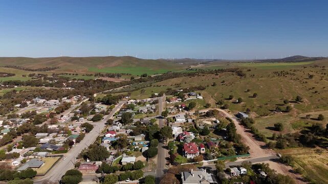 Burra, South Australia &ndash; 4K Aerial Drone Footage of Historic Pastoral Town, Country Houses, Estates, Streets, Canola Fields, and Wind Turbines in the Mid-North Agricultural Region