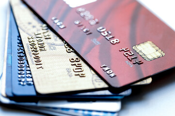 pile of credit cards on white background