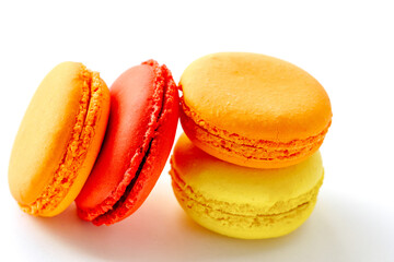 pile of colorful and tasty french macaroons on white background