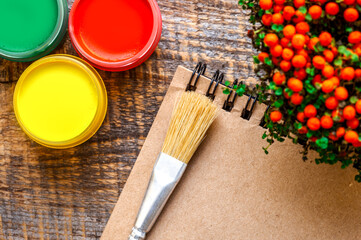 hobby painting workplace with colored gouache jars top view