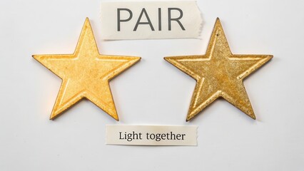 Pair of Golden Stars on White Background with Light Together Message