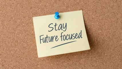 Stay Future Focused Inspirational Note on Corkboard Background