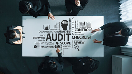 Business Meeting Focusing on Audit Procedures with Diverse Group Analyzing Compliance, Risk...