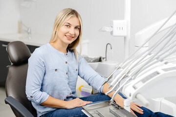 Patient sitting on dentist chair waiting for dental checkup