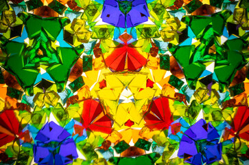 Natural kaleidoscope pattern captured with a camera, featuring vibrant stained glass colors and...