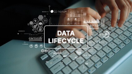Conceptual image of hands typing on keyboard with digital graphics illustrating data lifecycle processes and information management. Asymptotic smart data analytic.