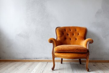 Orange velvet armchair sits against a textured wall.