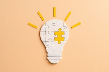 White puzzle lightbulb with glowing yellow piece on beige background creative concept of idea insight solution innovation strategy minimal clean business scene with space for text