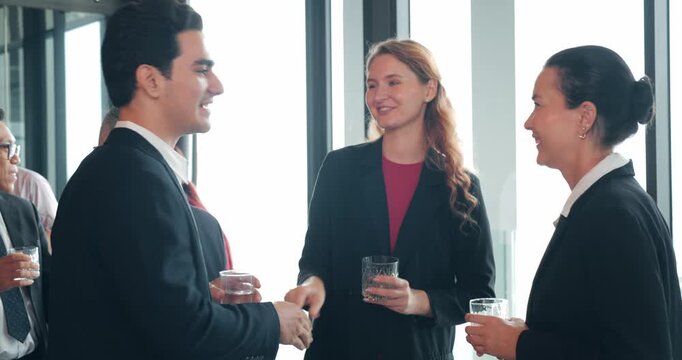 Group of diverse professionals businesspeople enjoying a networking event, listening to a startup business owner. Diverse people socialize at social networking event. Teamwork, Corporate concept