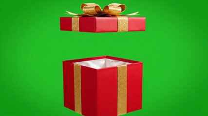 A red gift box with a gold ribbon opens in an animation. Vertical video of a present lid lifting on a green screen. Chroma key for holiday celebrations - Powered by Adobe