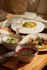 Delicious traditional dishes served on a wooden table