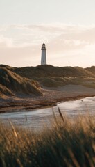 Serene coastal landscape with a majestic white lighthouse and gentle waves at sunset