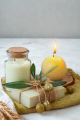 Spa relaxation with a lit candle and handmade soap