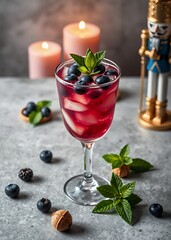 Glass of refreshing blueberry & coconut margarita cocktail served on gray cocrete table surface nutcrackers holiday  decoration christmas toy festive merry celebration