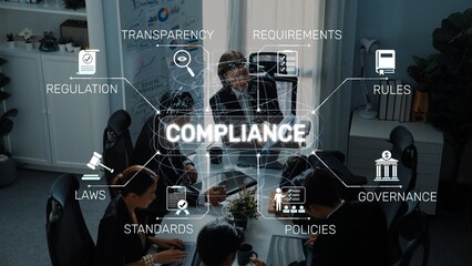 Professionals engage in a collaborative meeting focused on compliance related to laws and...