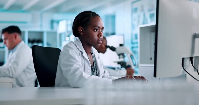 Doctor, woman or typing in lab with computer for medical innovation, science development or biotech. Scientist, people and research in clinic with pc for AI diagnostics, healthcare solution and plan.