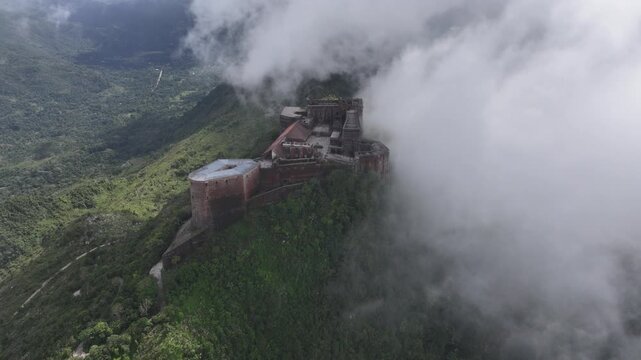 Citadelle Laferriere, fortress hilltop in clouds, Cap-Haitien, Haiti. Aerial drone approach