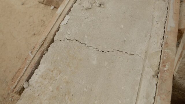 Cracks are visible on the concrete as it dries during the house construction process. This shows the importance of monitoring concrete curing conditions.