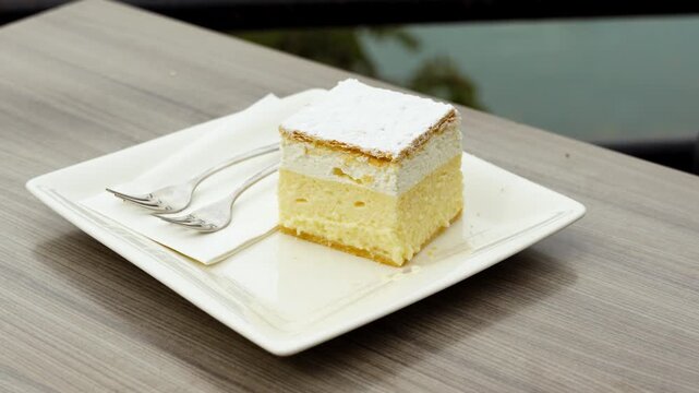 Closeup arcing view of zesty Bled Cream Cake (Krem&scaron;nita) at Kavarna Park Caf&eacute;