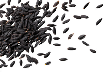Black seeds scattered on dark background