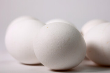A Macro Shot Of Several White Eggs With A Textured Shell, A Concept Of Healthy Breakfast, Cooking Ingredients, And Easter.