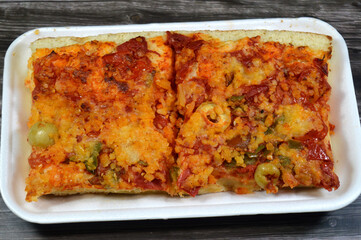 Vegetables Pizza with various toppings, olives, peppers, tomatoes, melted mozzarella cheese, The Pizza has a golden brown baked crust, Vegetables vegetarian toppings Pizzas, Italian food concept