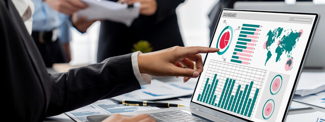 Business intelligence and data analysis concept. Analyst team working on financial data analysis...