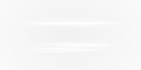 A pair of bright white lights shining on a deep black background