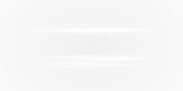 A pair of bright white lights shining on a deep black background