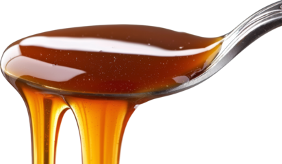 honey dripping from spoon