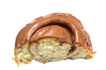 part of chocolate cinnamon roll, a type of sweet roll or pastry that made of rolled dough with a cinnamon and sugar mixture then topped with chocolate glaze or frosting