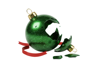 Isolated broken green Christmas ornament with sparkling glitter and a flowing red ribbon shattered festive holiday decoration for winter season celebration