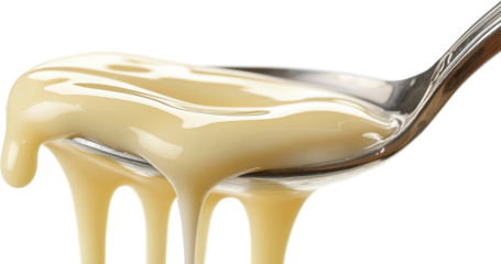 condensed milk dripping from spoon 