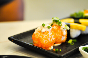 shrimp egg rolls or rice topped with fish or Japanese rolls
