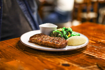 Appetizing Grilled Steak with Broccoli and Potato Puree Food on Plate