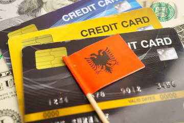 Albania flag on credit card, finance economy trading shopping online business.