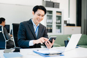 Asian Businessman accountant or financial expert analyze business report graph and finance chart. banking business and stock market research.