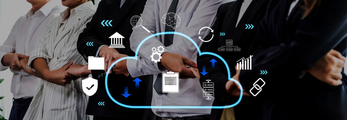 Business team standing together with arms crossed, surrounded by cloud computing graphics and digital icons that illustrate concepts of growth, technology, and collaboration. Trope