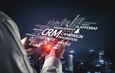 A business professional interacts with a digital interface showcasing CRM, management, and campaign...