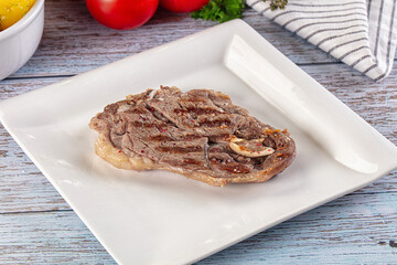 Grilled lamb steak with bone