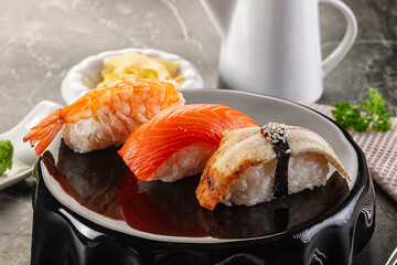 Japanese cuisine - sushi with eel, salmon and prawn