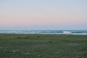 Calm sea and pastel sunset sky