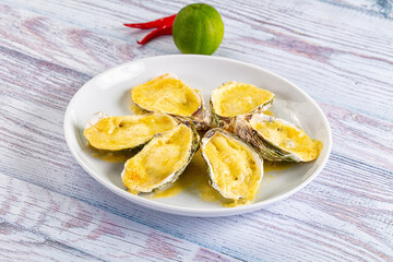 Baked oyster with parmesan cheese
