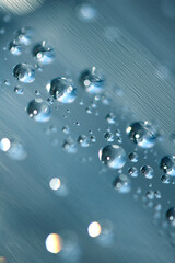 Close up of abstract floating bubbles water droplets condensation rain on a glass transparent bokeh background