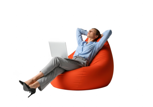 Relaxed woman in business attire using laptop while reclining on orange bean bag isolated on transparent background