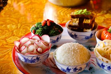 A variety of delicious vegetable foods, symmetrical in Chinese style, for offering to Buddha