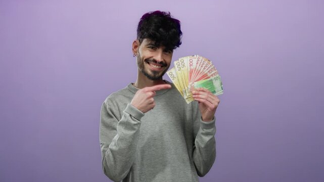 Smiling man holding fan of norwegian krone banknotes against purple background symbolizing wealth success and prosperity in modern scandinavian setting.