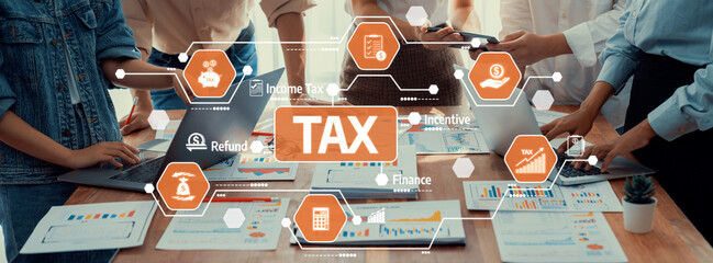 A vibrant office scene showcasing professionals discussing tax services surrounded by laptops and...