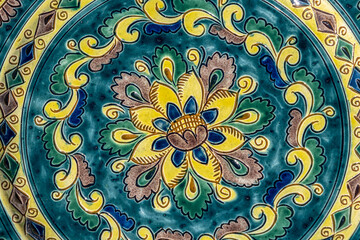 close up of  ornamental ceramic plate background